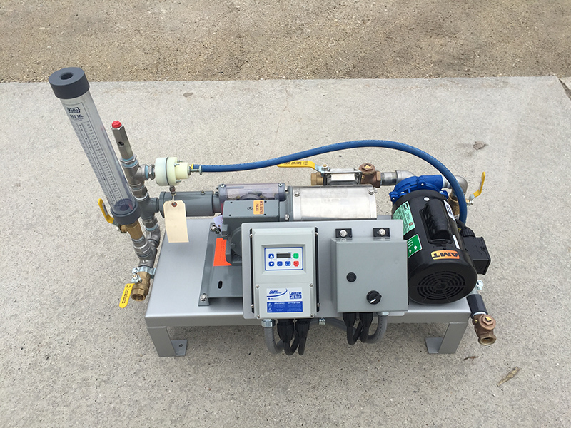 This is an image of Clearwater's LQ50 which is a liquid polymer dosing system that features a dilution water pump, neat polymer pump, calibration column, VFD control and components.