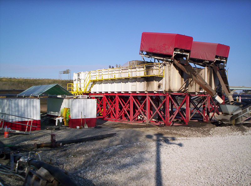 Two large clarifiers treat water and remove contaminated sediment at an environmental clean-up site.