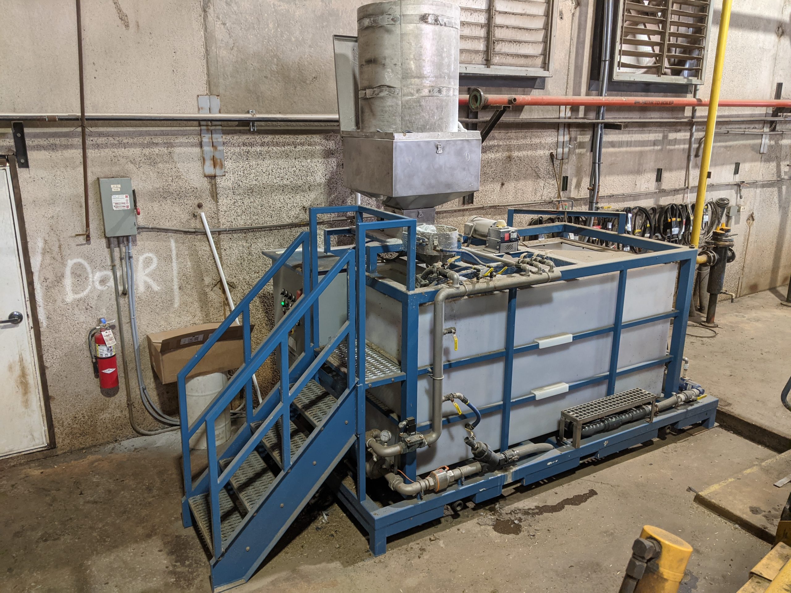 Clearwater Industries M500 dry polymer preparation unit in a dairy barn where it is used to aid in manure liquid-solid separation.