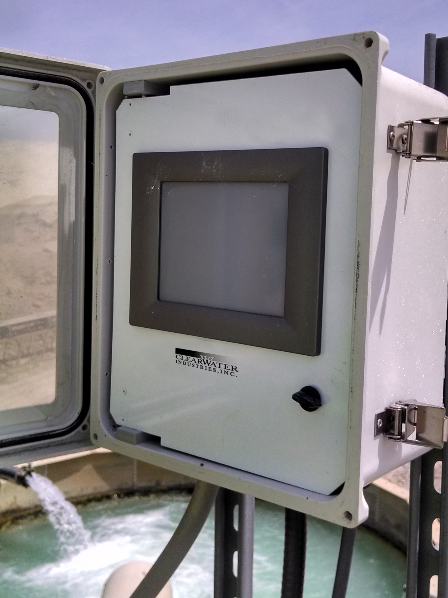 A touchscreen device that acts as the messenger screen for Clearwater's Autofloc system setup at a sand and gravel facility.