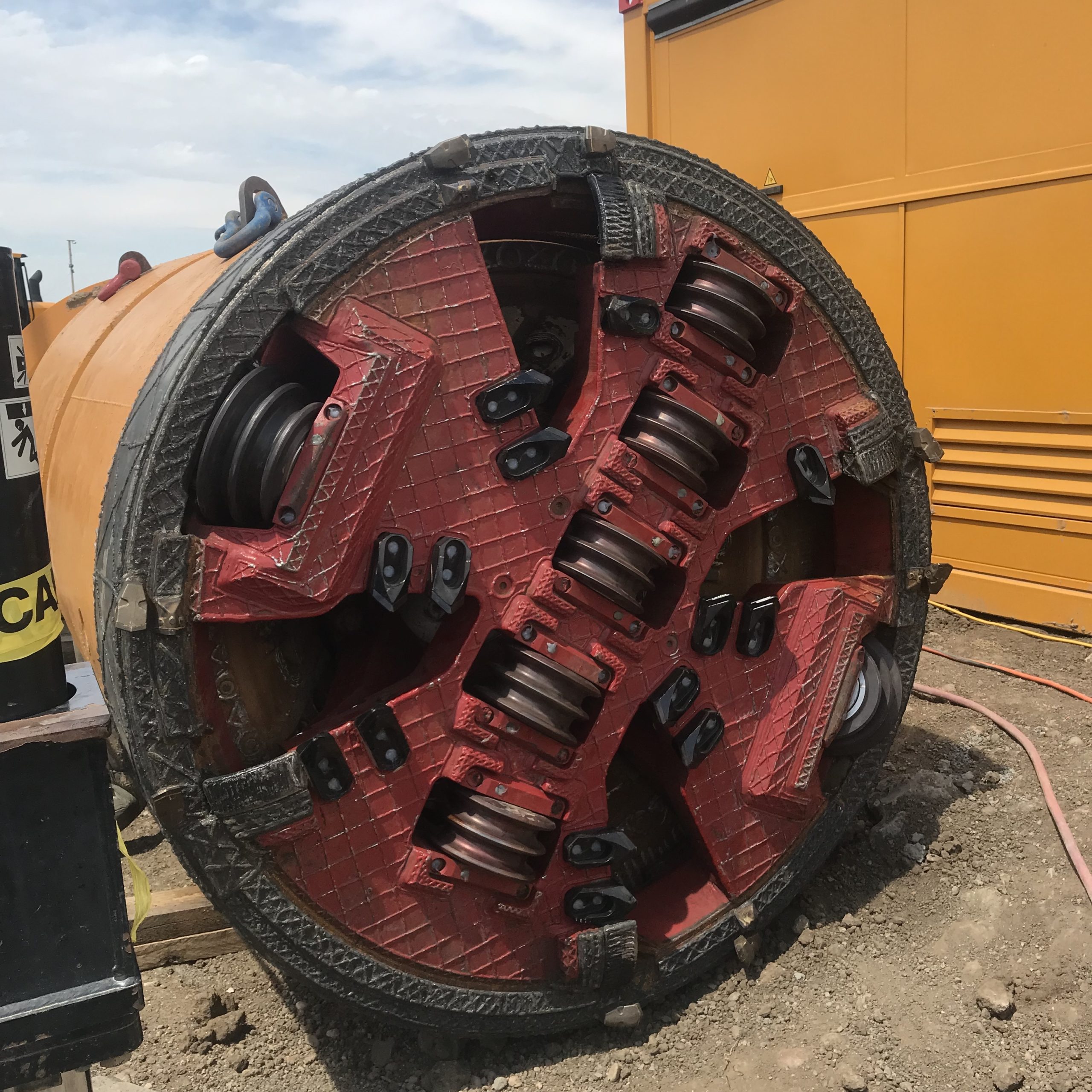 The front of a microtunneling boring machine at a job site.