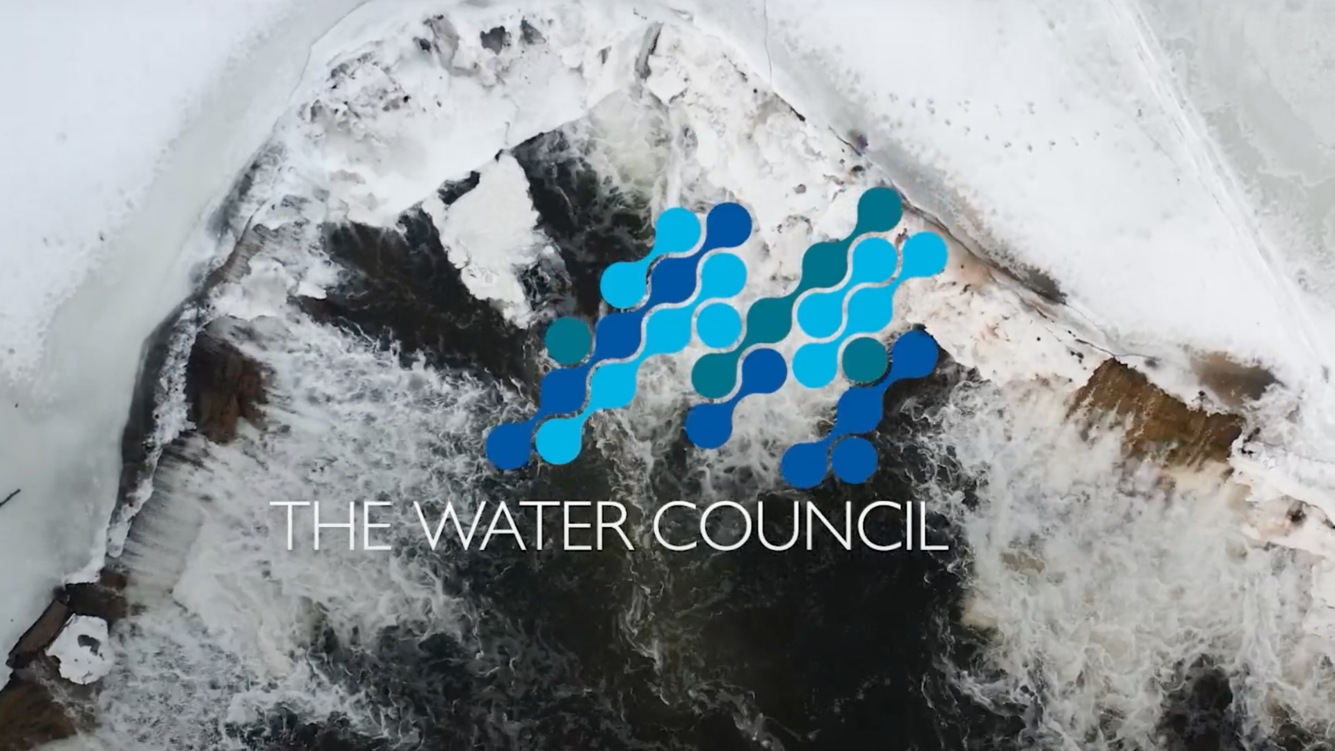 A water fall in winter shot from above by a drone with The Water Councils logo overlayed.